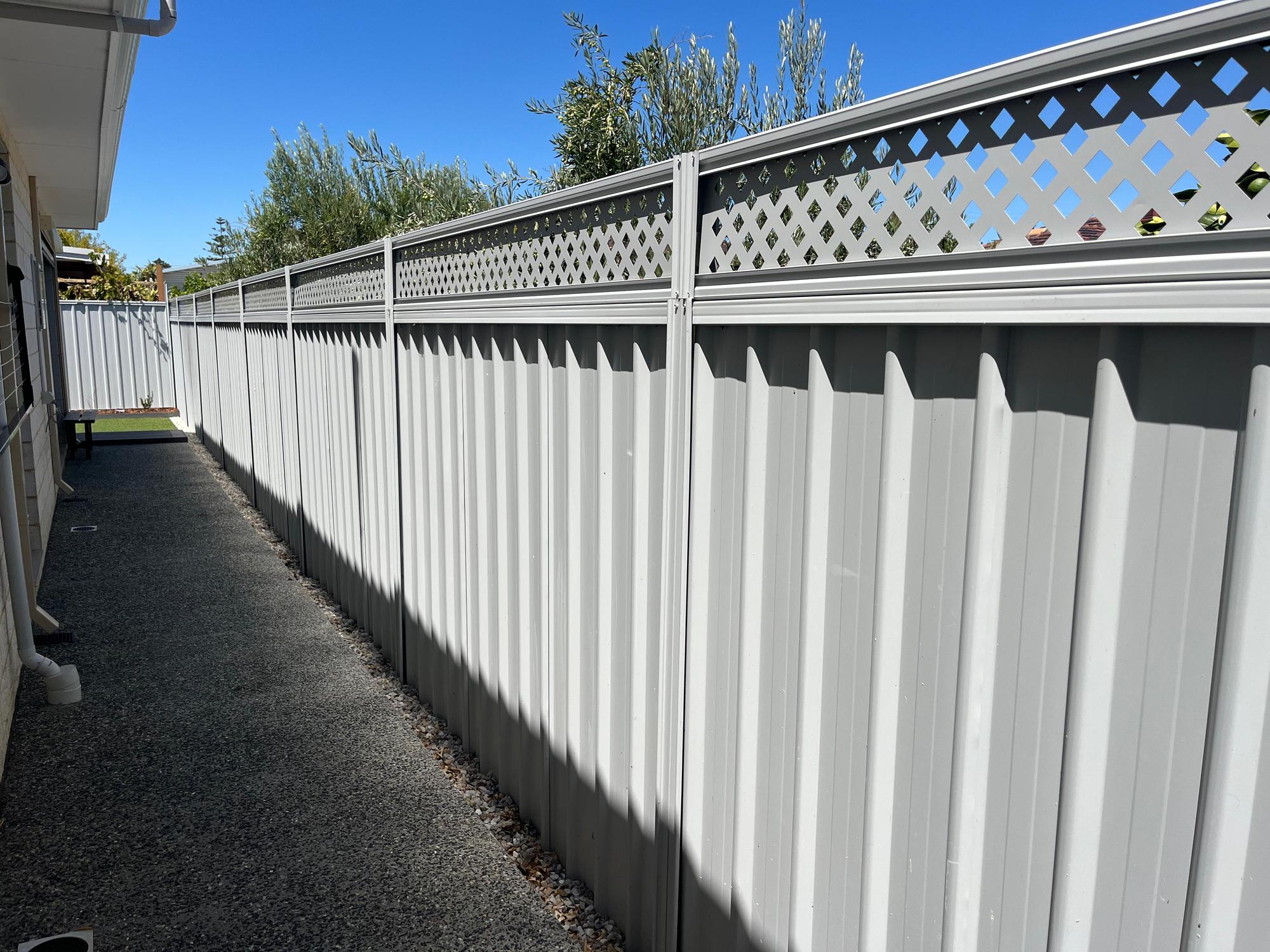 Colorbond fencing with lattice top installed in Perth