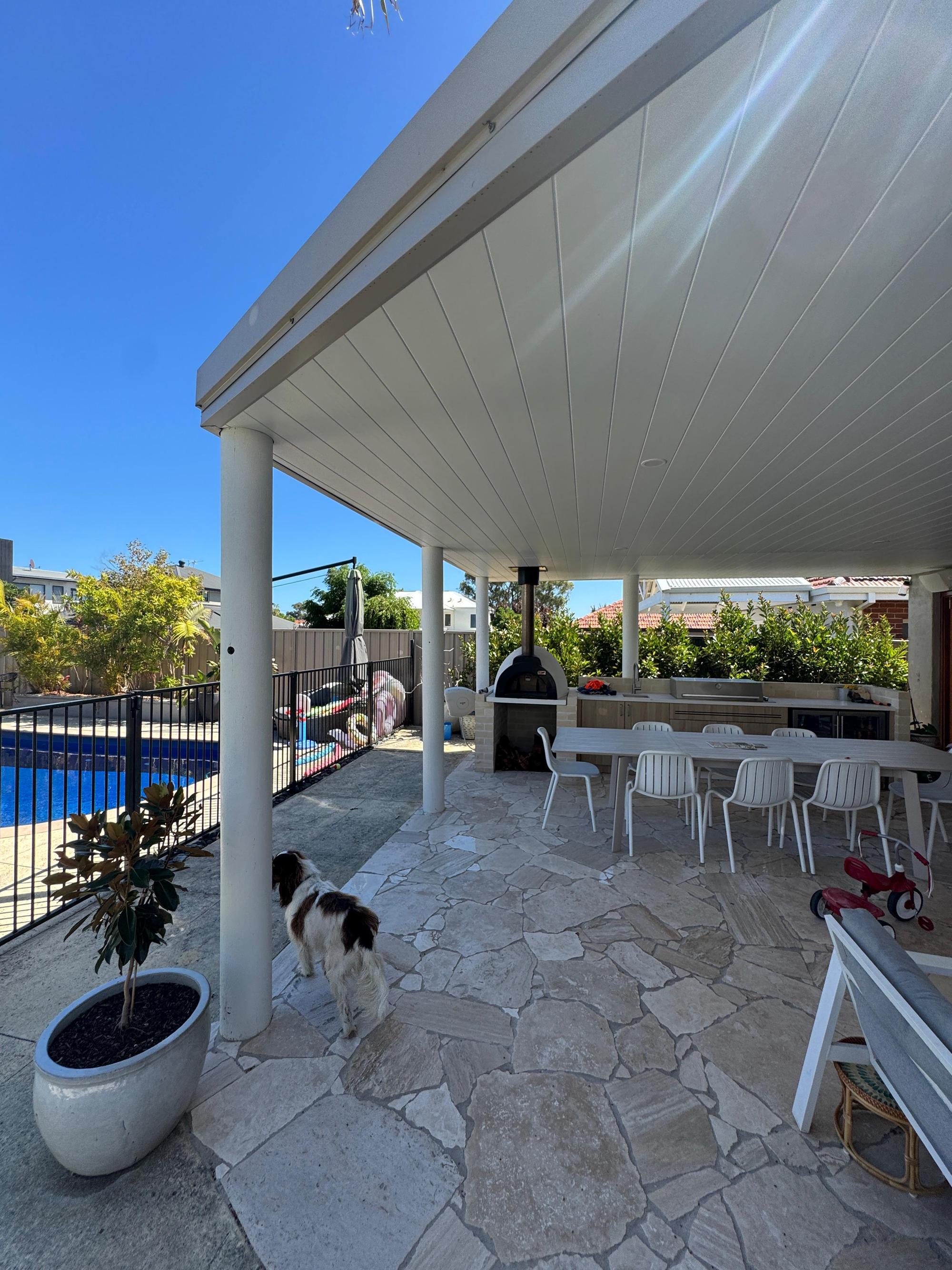 Freestanding patio pavilion beside pool in Perth backyard